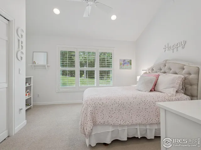 a bathroom with a toilet a sink a mirror a bathtub and vanity