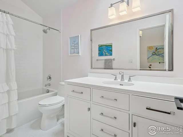 a spacious bedroom with a bed and a large window