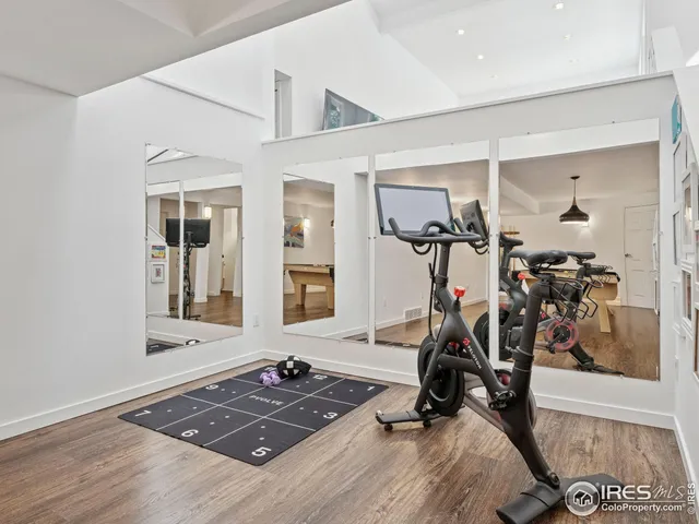 a view of a patio with couches table and chairs and potted plants