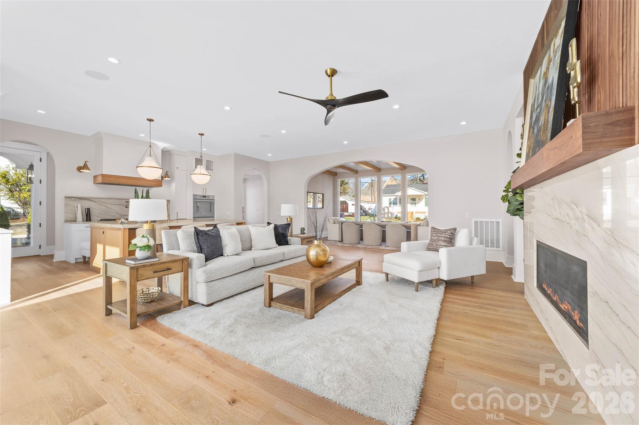 216 Walnut Street Davidson, NC 28036 - Photo 12 of 48 a living room with fireplace furniture and a large window