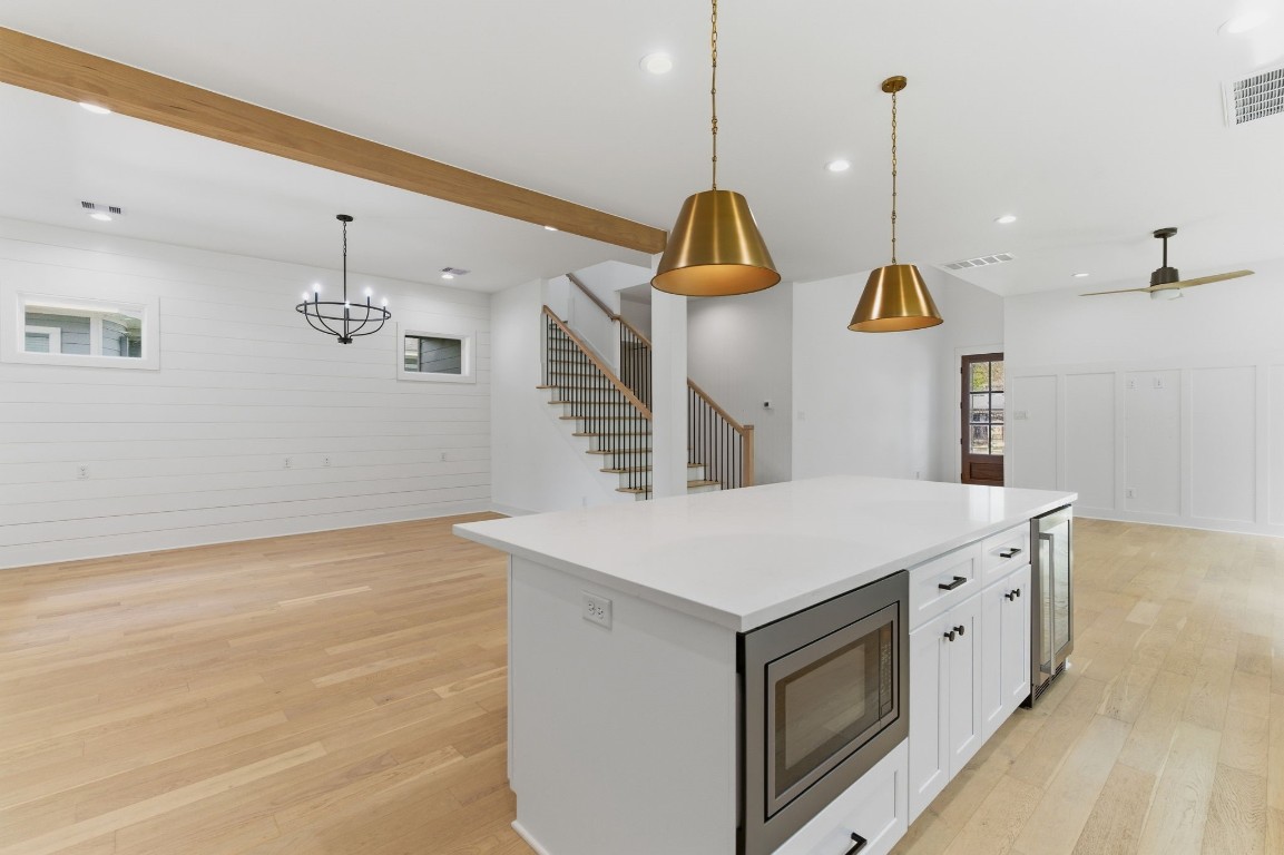 1005 Walton Street Houston, TX 77009 - Photo 36 of 36 Wonderful open floor plan is perfect for entertaining. Built in microwave and beverage fridge in the island.