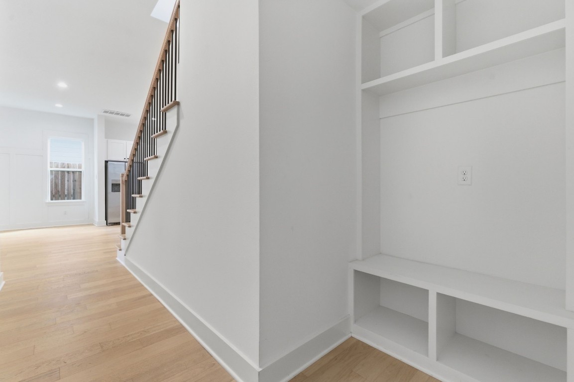 1005 Walton Street Houston, TX 77009 - Photo 21 of 36 Storage nook for coats, backpacks, etc is tucked away under the stairs right off of the entrance from the garage.