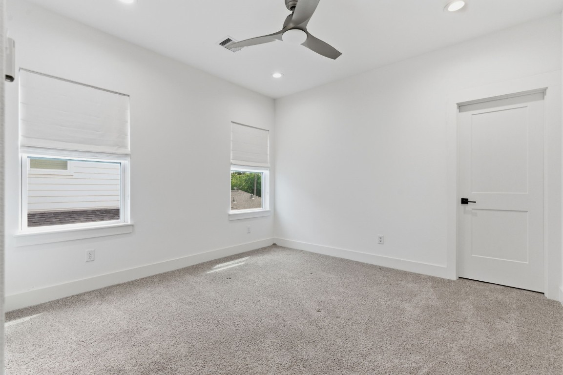 1005 Walton Street Houston, TX 77009 - Photo 28 of 36 One of 3 secondary bedrooms upstairs.
