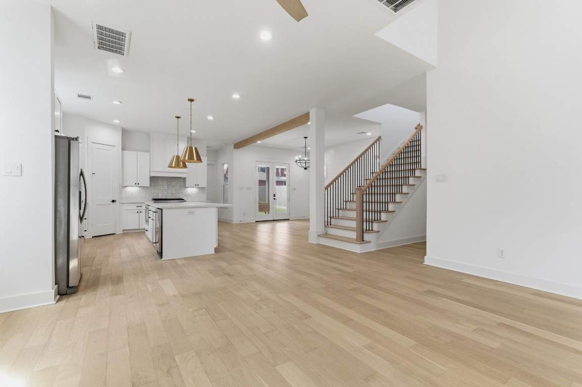 1005 Walton Street Houston, TX 77009 - Photo 7 of 36 View of the kitchen and dining room with open staircase leading you to an oversized Game Room, 3 bedrooms and 2 full bathrooms upstairs.