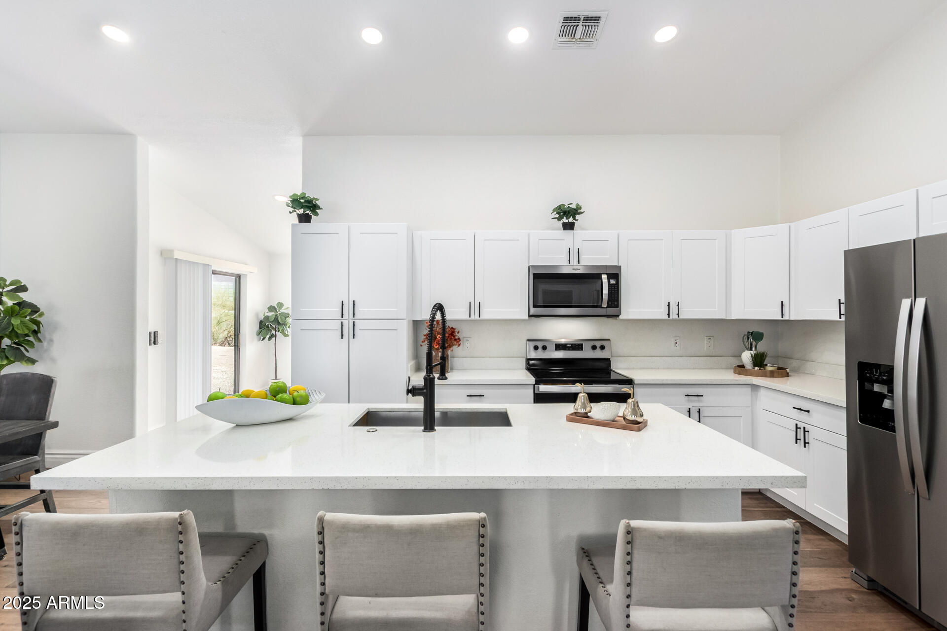 1737 South Mountain View Road Apache Junction, AZ 85119 - Photo 2 of 25 a kitchen with a sink a stove and refrigerator