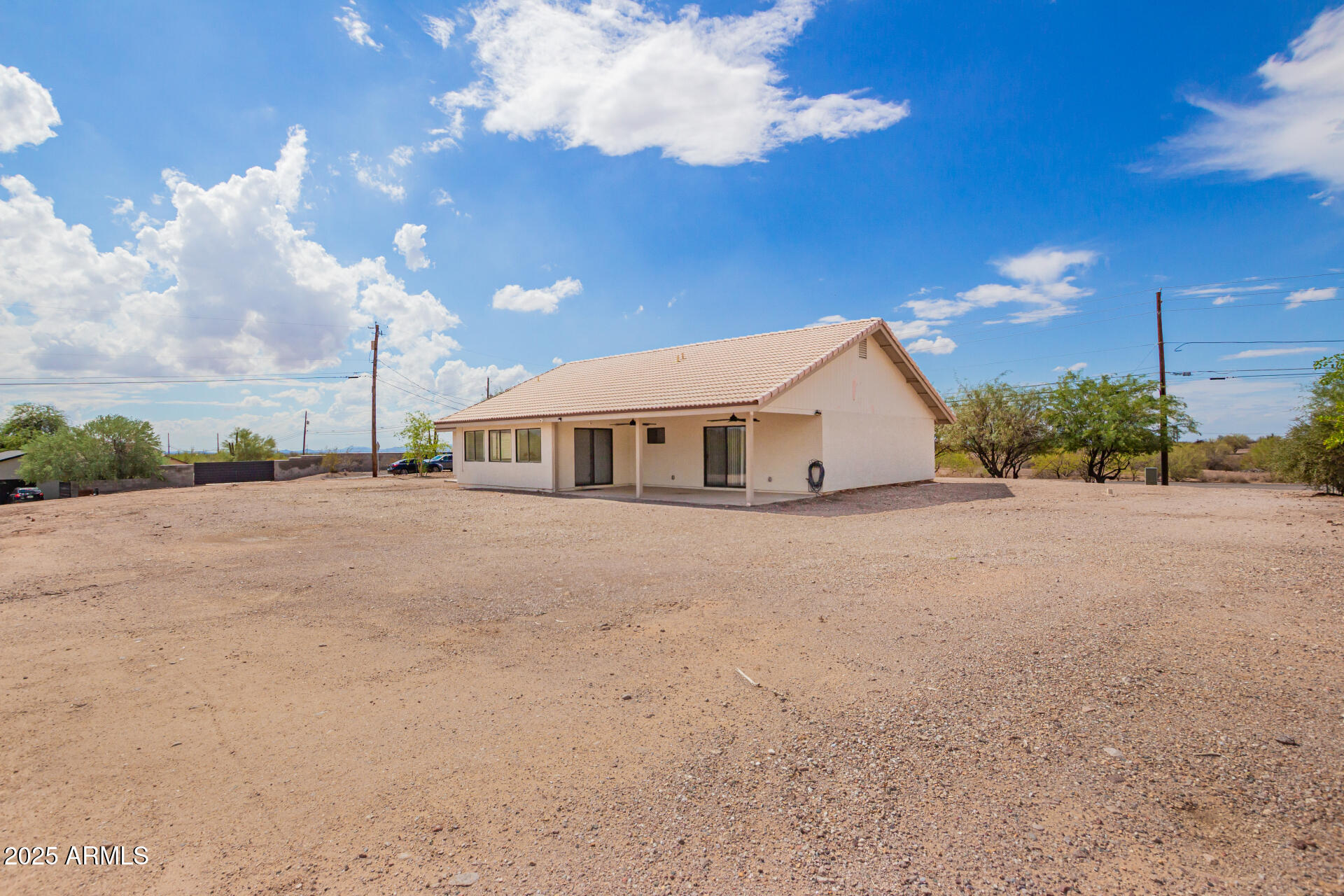 1737 South Mountain View Road Apache Junction, AZ 85119 - Photo 23 of 25 a view of a house with a yard