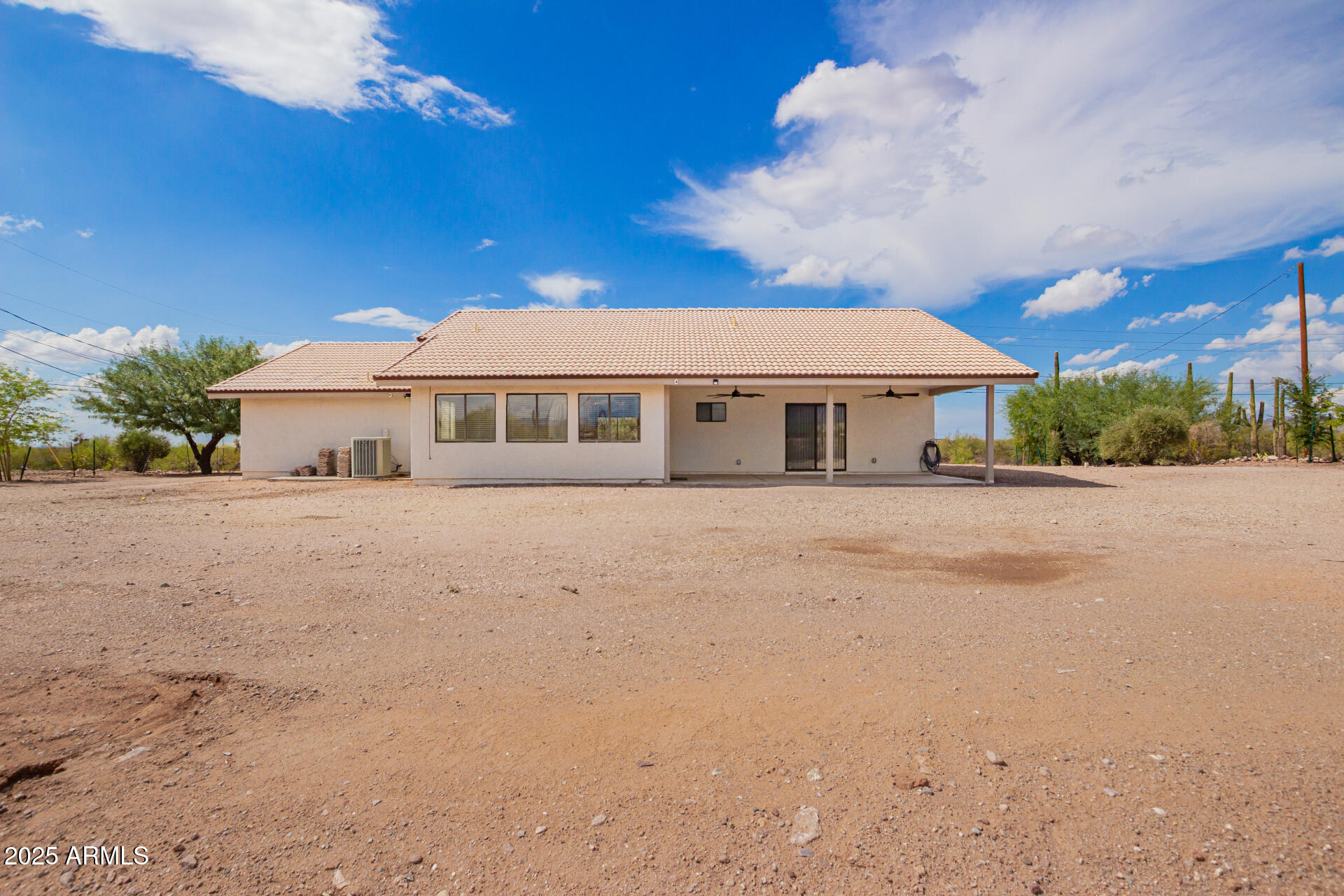 1737 South Mountain View Road Apache Junction, AZ 85119 - Photo 24 of 25 a front view of a house with a yard