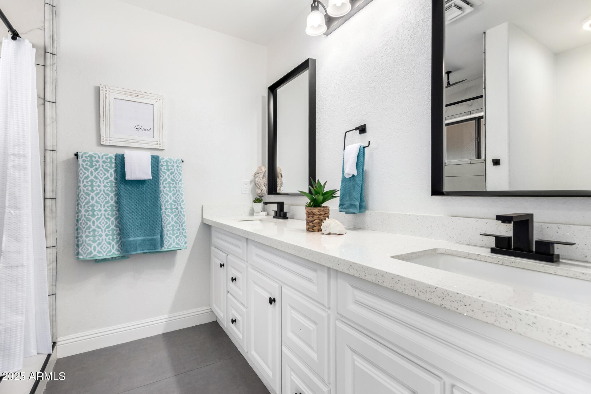 1737 South Mountain View Road Apache Junction, AZ 85119 - Photo 10 of 25 a bathroom with a sink and a mirror