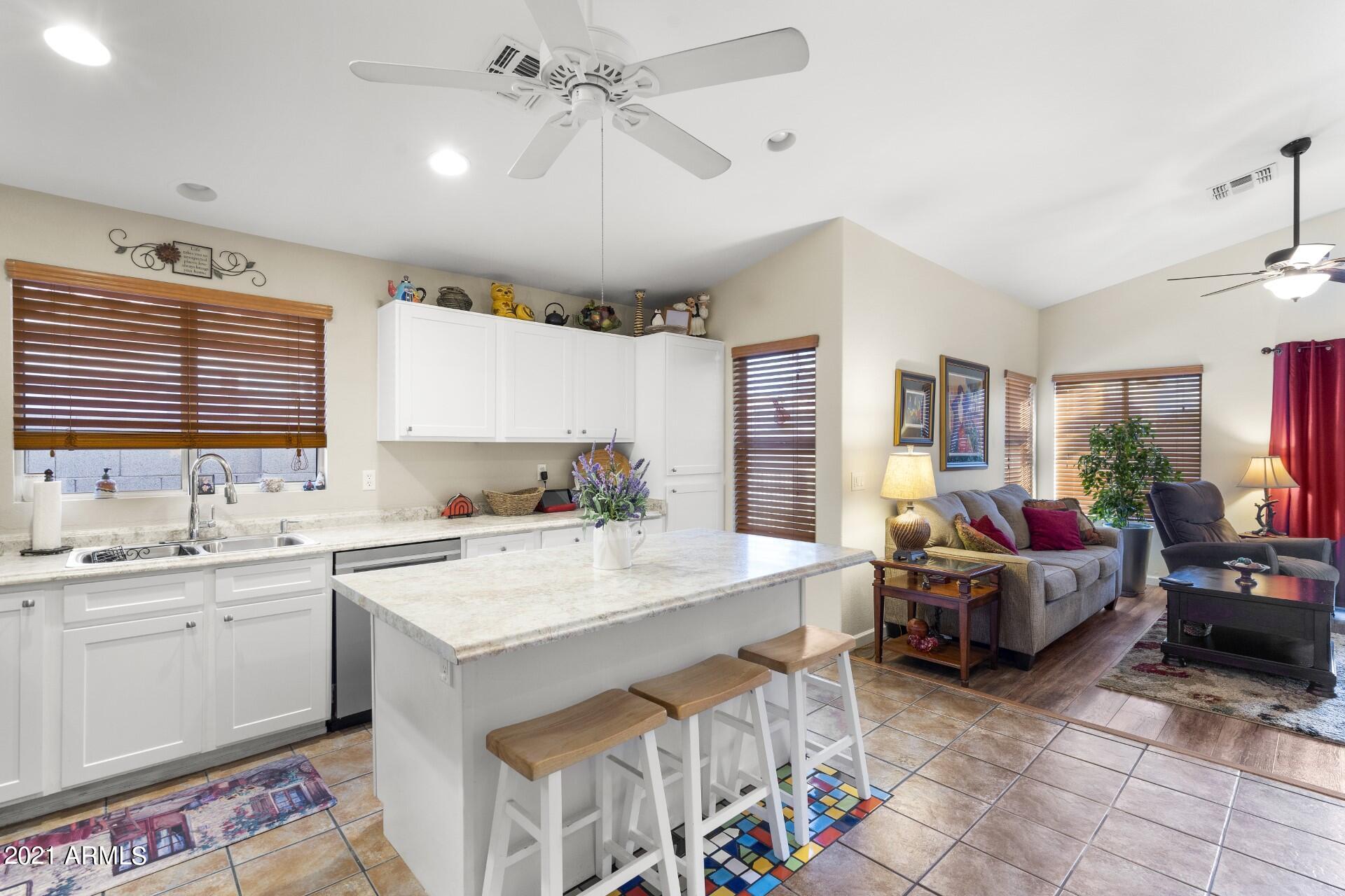 4161 West Bloomfield Road Phoenix, AZ 85029 - Photo 11 of 36 a view of a kitchen and living room