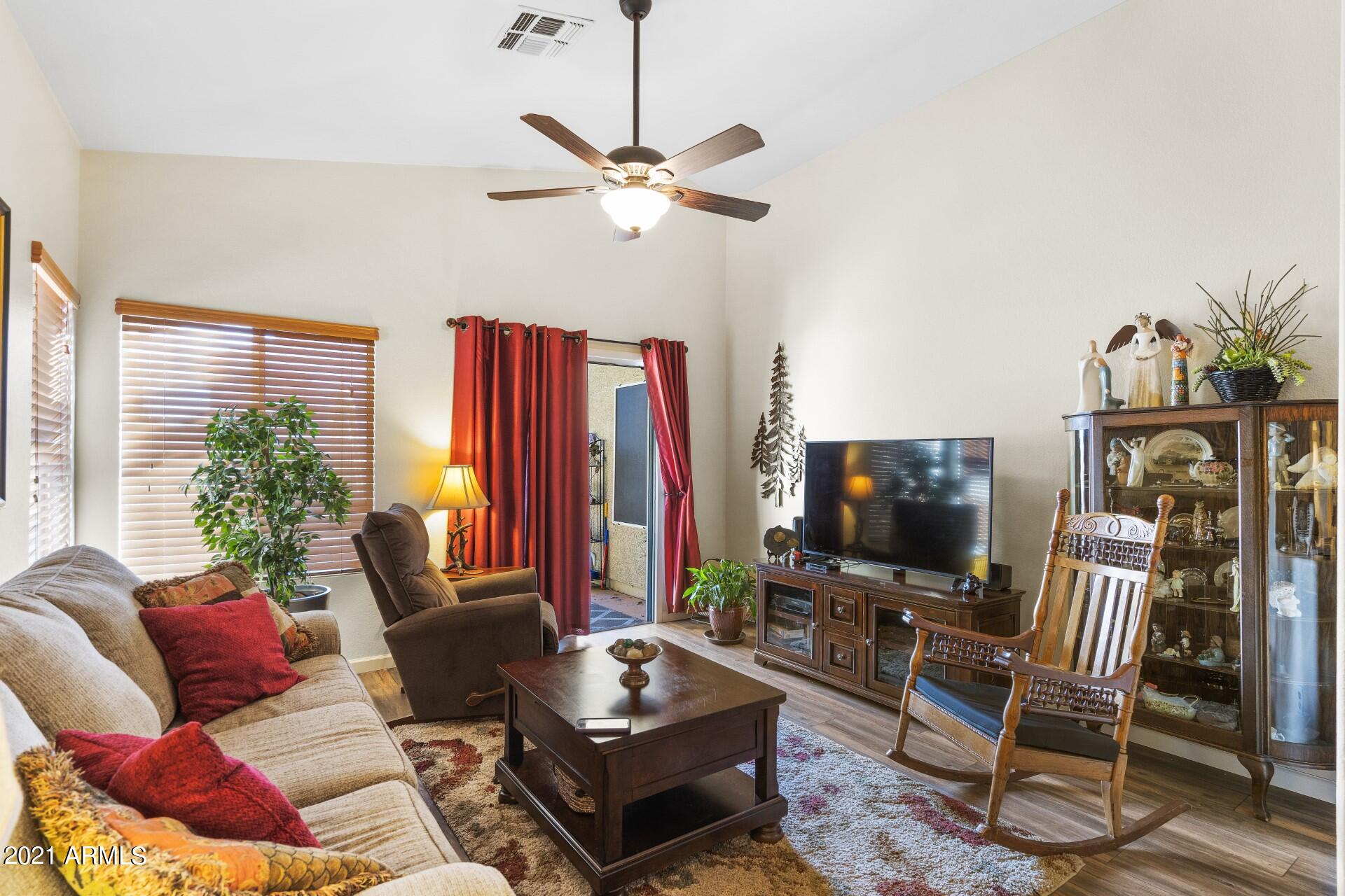 4161 West Bloomfield Road Phoenix, AZ 85029 - Photo 13 of 36 a living room with furniture and a flat screen tv