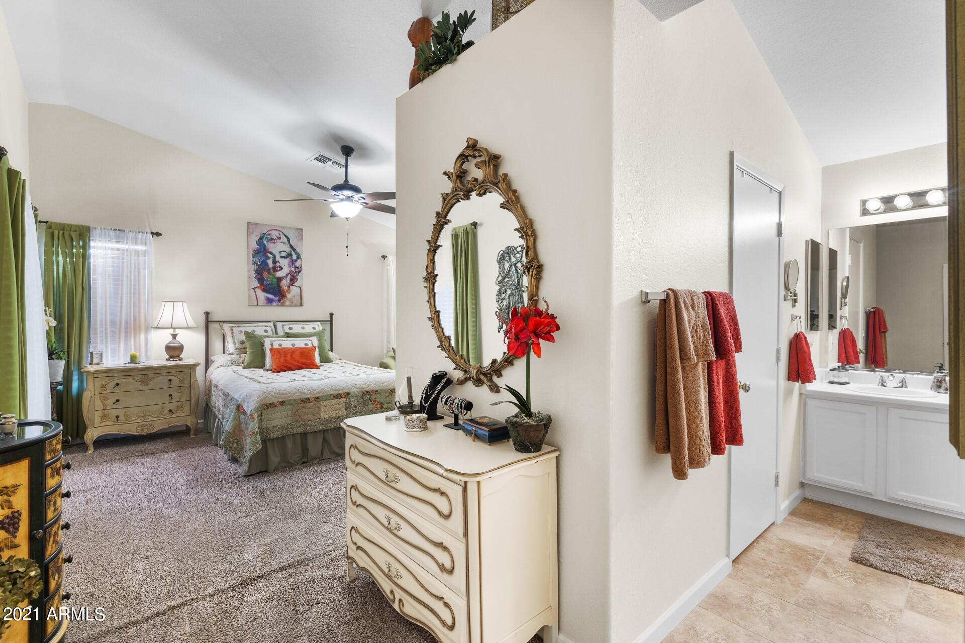 4161 West Bloomfield Road Phoenix, AZ 85029 - Photo 19 of 36 a living room with furniture and a mirror