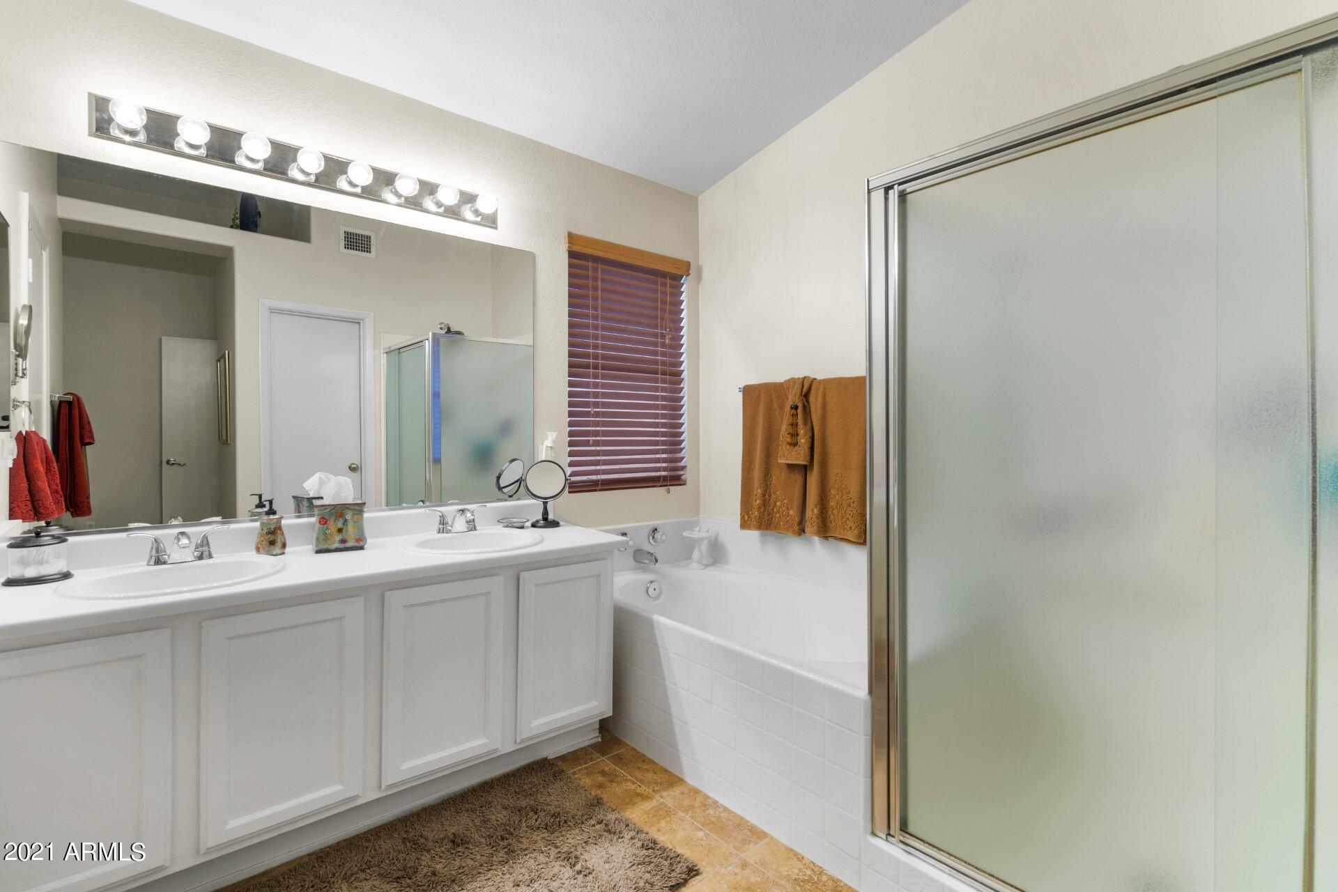 4161 West Bloomfield Road Phoenix, AZ 85029 - Photo 20 of 36 a bathroom with a double vanity sink mirror and double