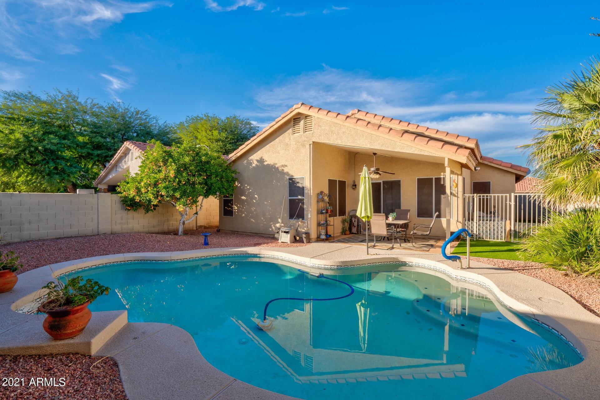 4161 West Bloomfield Road Phoenix, AZ 85029 - Photo 2 of 36 a view of a house with backyard outdoor seating area and furniture