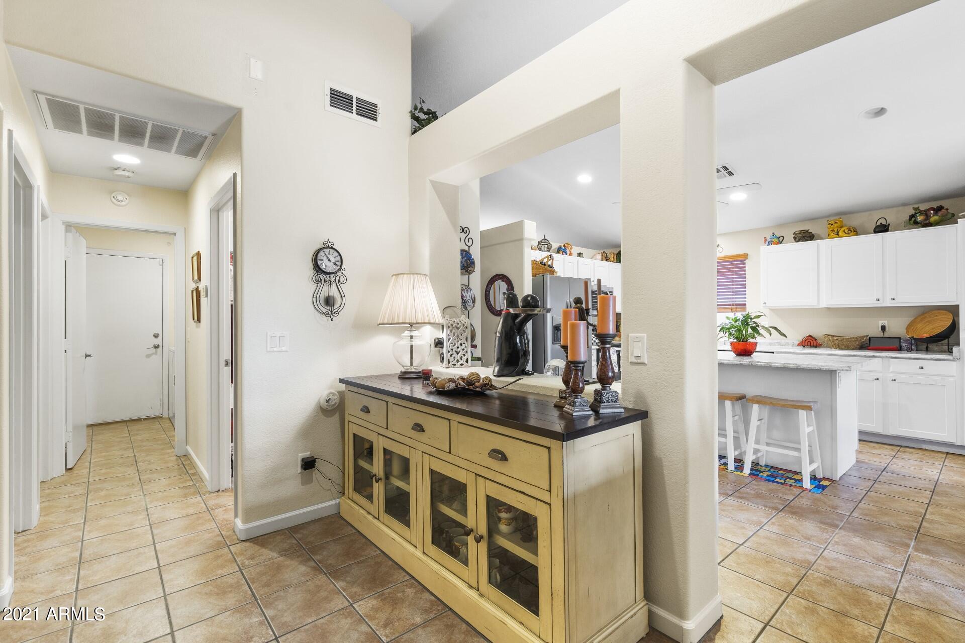 4161 West Bloomfield Road Phoenix, AZ 85029 - Photo 22 of 36 a view of kitchen with stainless steel appliances kitchen island granite countertop a table and chairs in it