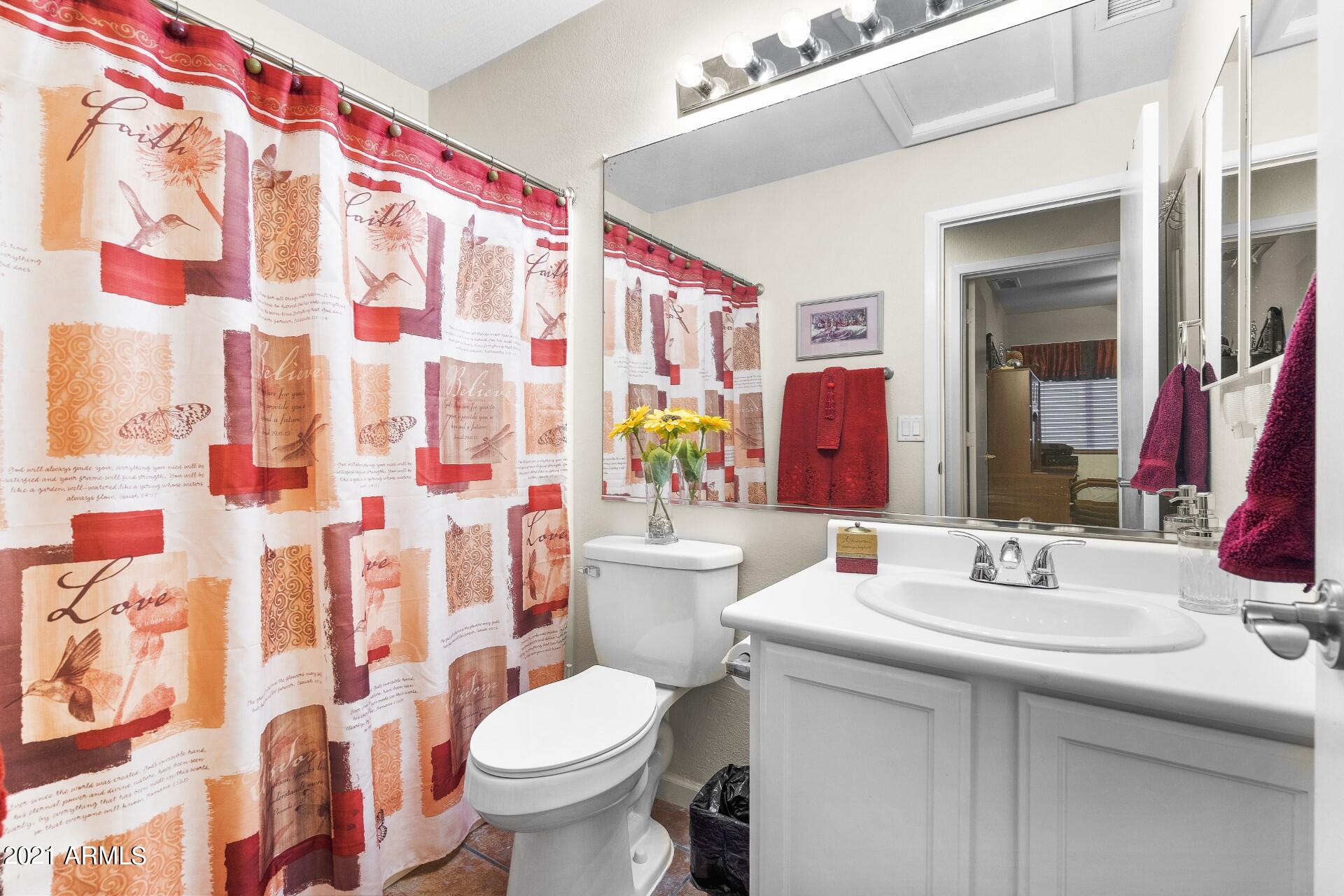 4161 West Bloomfield Road Phoenix, AZ 85029 - Photo 25 of 36 a bathroom with a sink toilet and shower