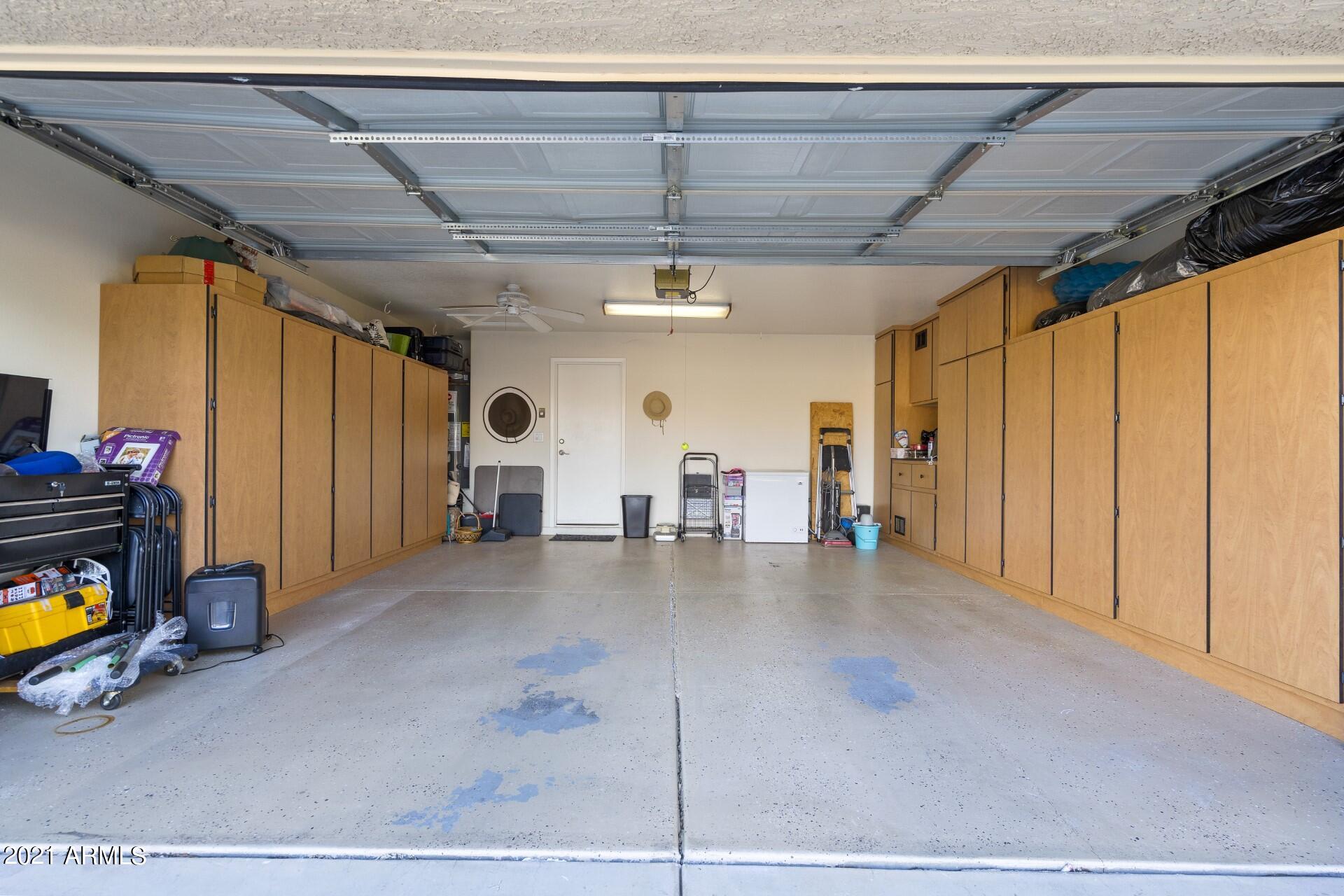 4161 West Bloomfield Road Phoenix, AZ 85029 - Photo 27 of 36 a view of a livingroom with furniture and a garage