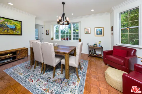 a view of a livingroom with furniture and a window