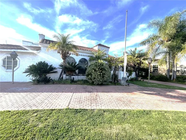a front view of a house with a yard and a garage