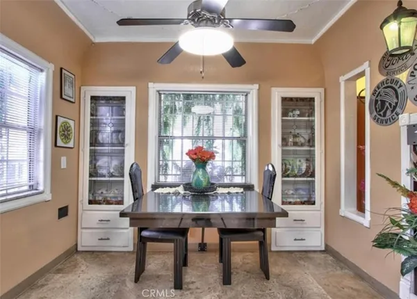 a dining room with furniture and window