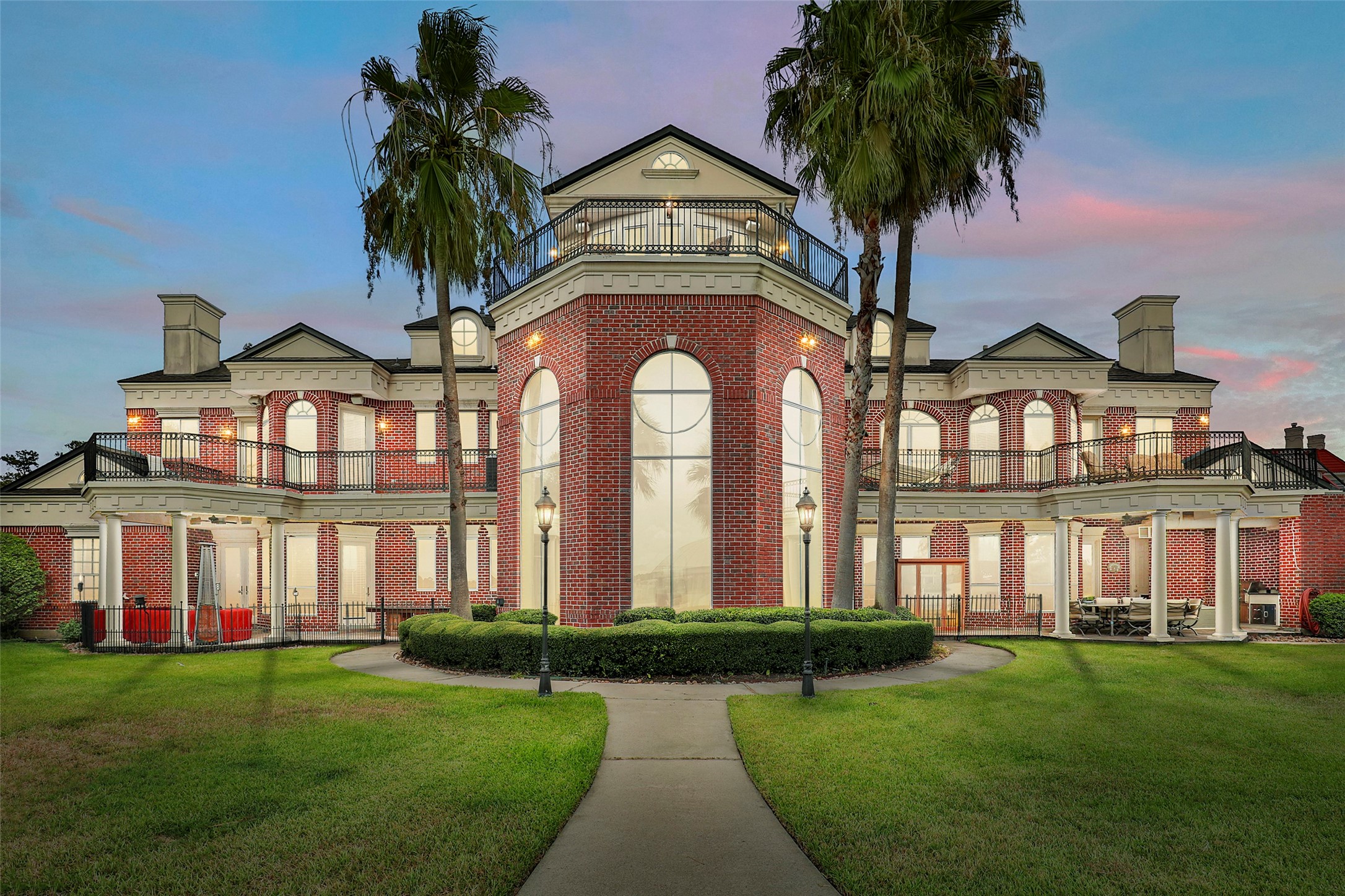 46 South Windsail Place The Woodlands, TX 77381 - Photo 1 of 47 front view of a house with a garden