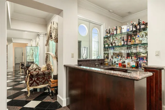 a view of a dining room with furniture and a chandelier