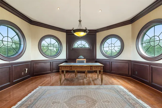 a bedroom with bed couch and window