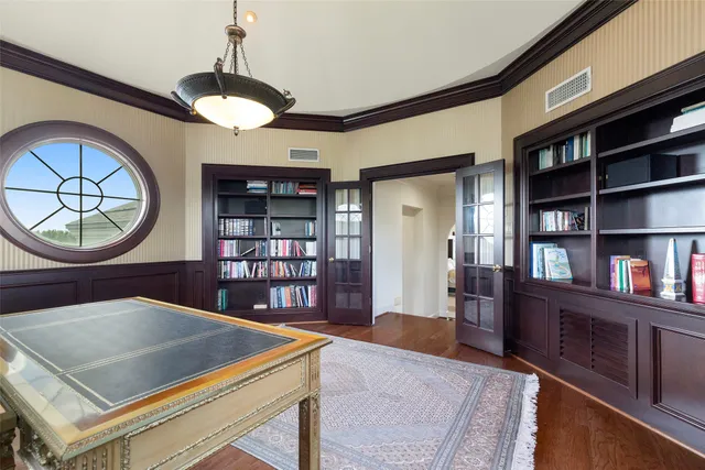 a view of a dining room with furniture and chandelier