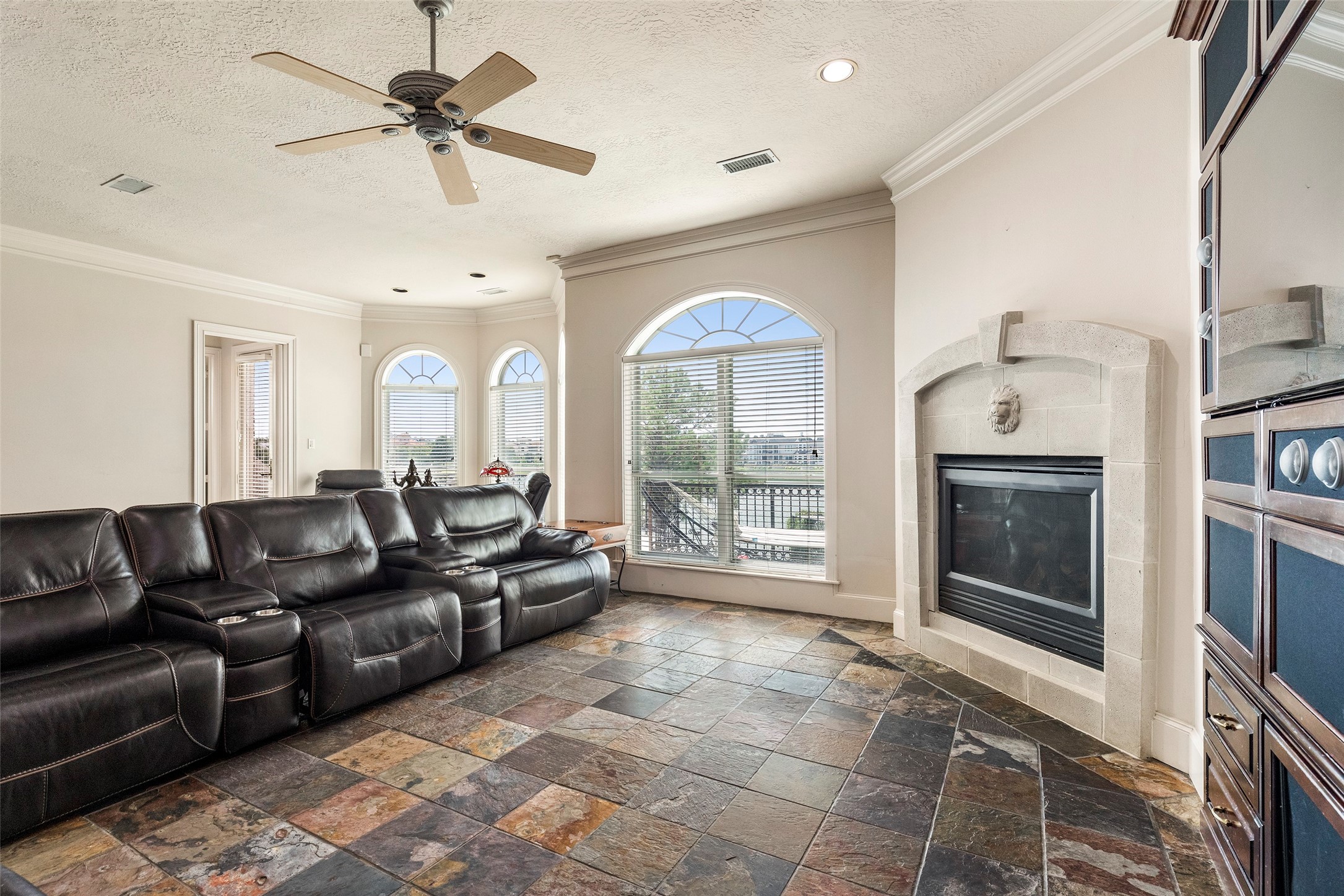 46 South Windsail Place The Woodlands, TX 77381 - Photo 33 of 47 a living room with furniture and a floor to ceiling window