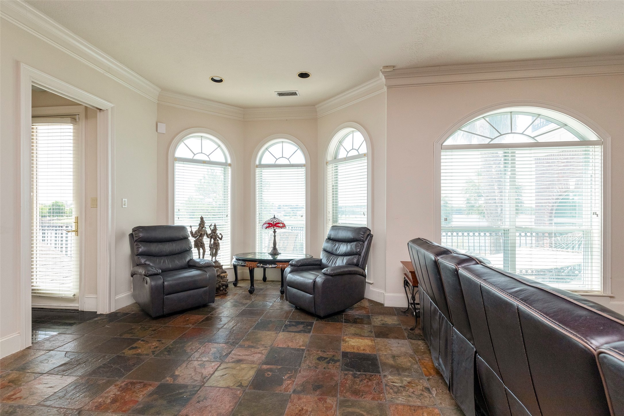 46 South Windsail Place The Woodlands, TX 77381 - Photo 34 of 47 a living room with furniture and large windows