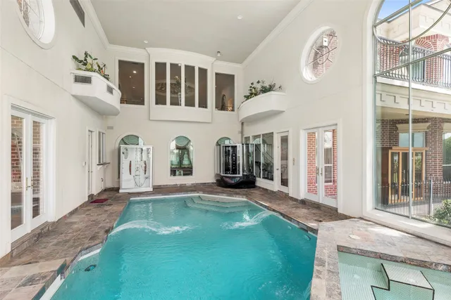 a swimming pool with outdoor seating yard and barbeque oven