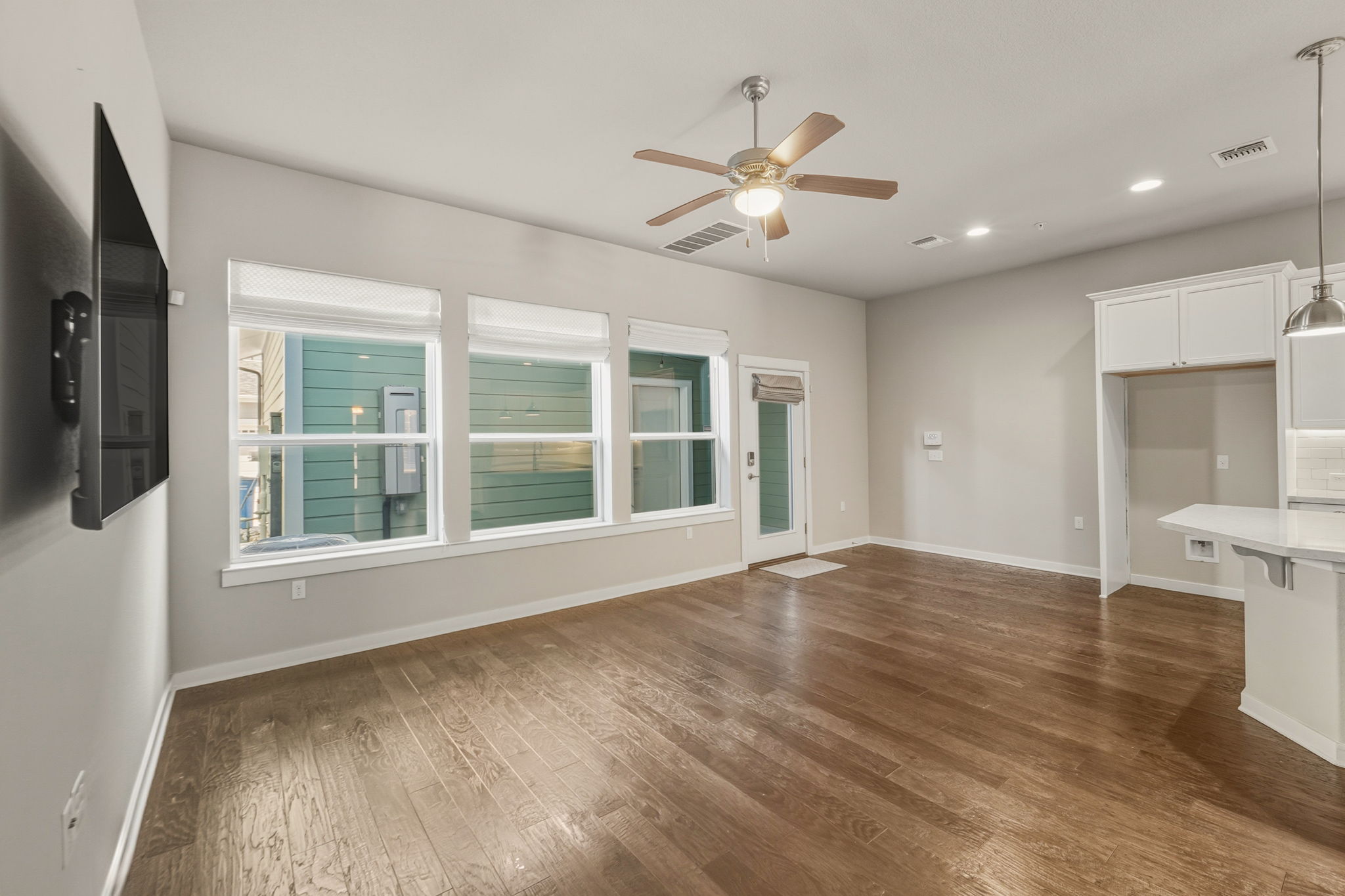 3919 Vaughan Street Austin, TX 78723 - Photo 16 of 40 Unfurnished living room with recessed lighting, a ceiling fan, and dark wood-style floors