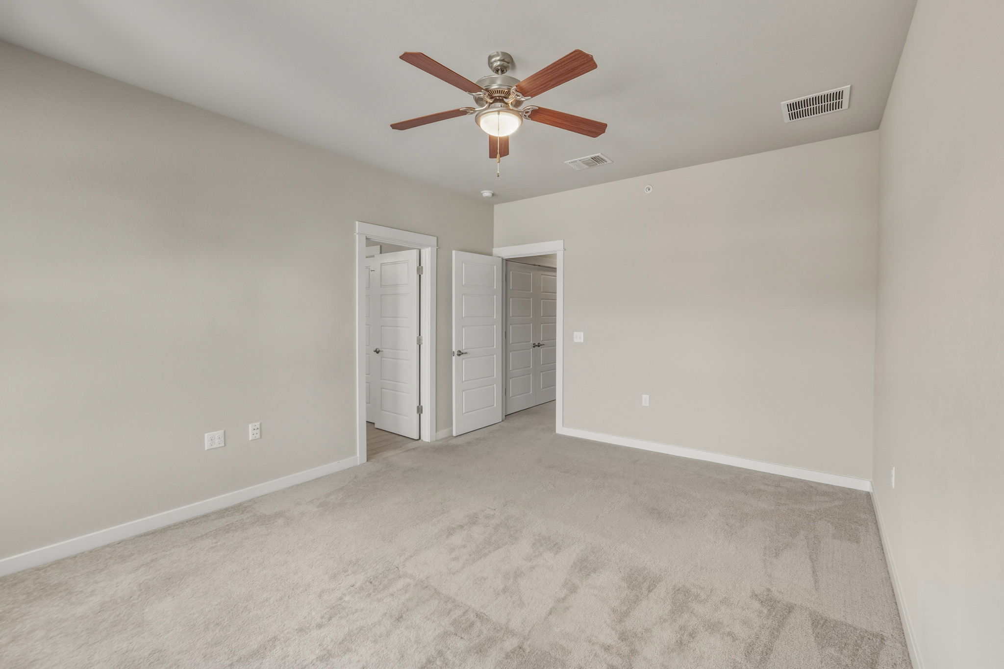 3919 Vaughan Street Austin, TX 78723 - Photo 19 of 40 Unfurnished bedroom with light colored carpet and ceiling fan