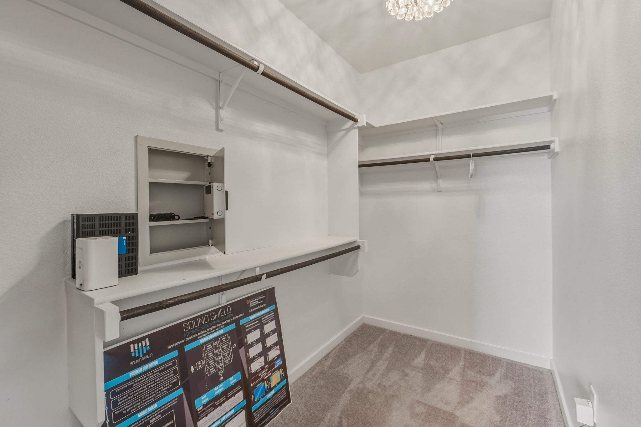 3919 Vaughan Street Austin, TX 78723 - Photo 24 of 40 Walk in closet with light carpet and a chandelier