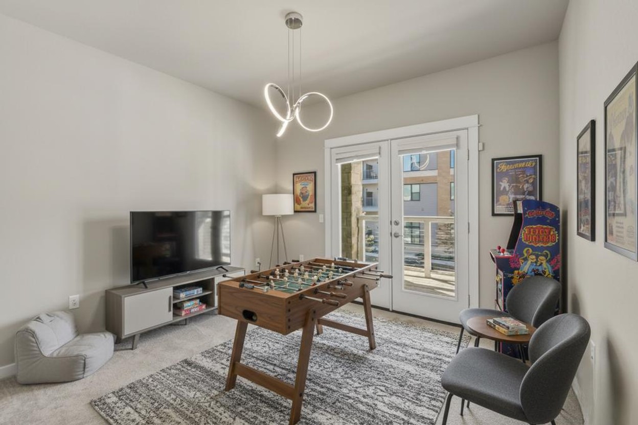 3919 Vaughan Street Austin, TX 78723 - Photo 26 of 40 Playroom featuring carpet and french doors