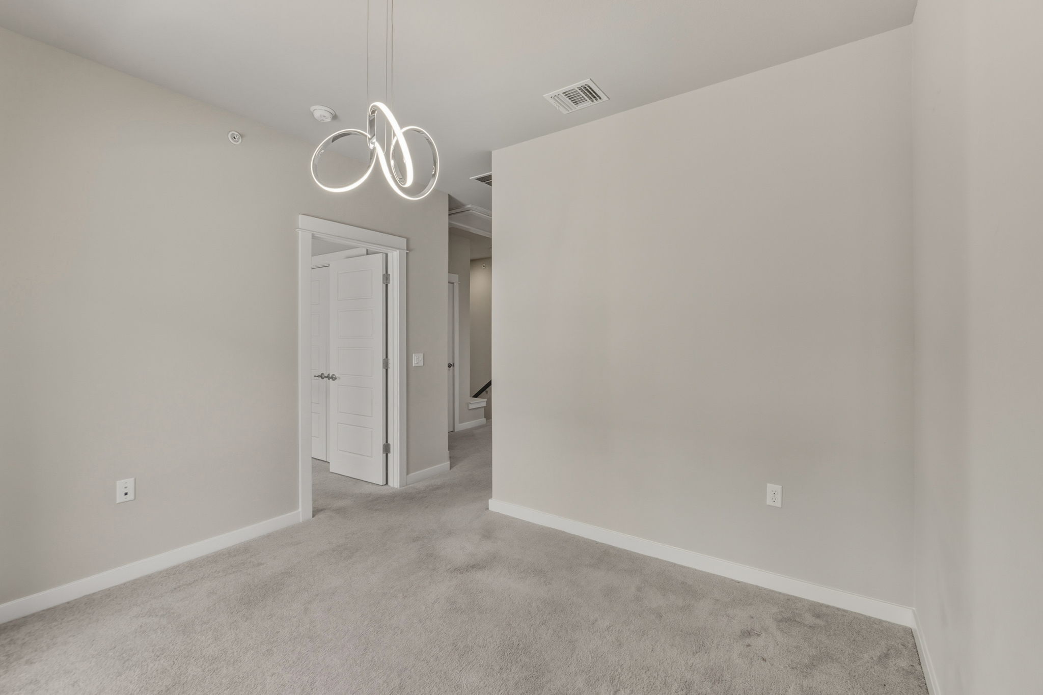 3919 Vaughan Street Austin, TX 78723 - Photo 27 of 40 Carpeted spare room featuring baseboards