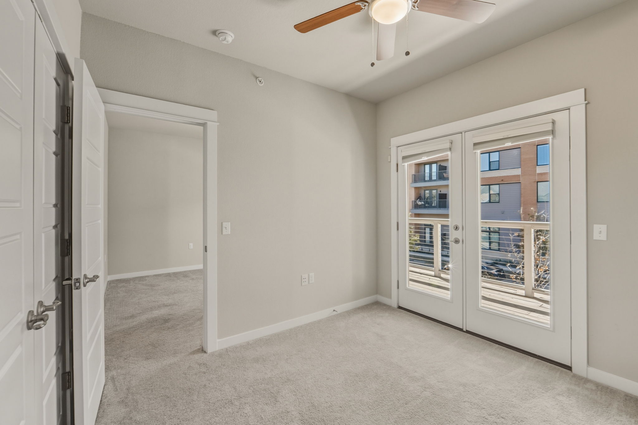 3919 Vaughan Street Austin, TX 78723 - Photo 29 of 40 Unfurnished room featuring french doors, light colored carpet, and ceiling fan