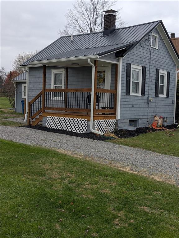7 7th Street Bessemer, PA 16112 - Photo 2 of 24 a front view of a house with a garden
