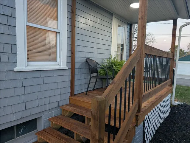 a view of balcony with wooden floor