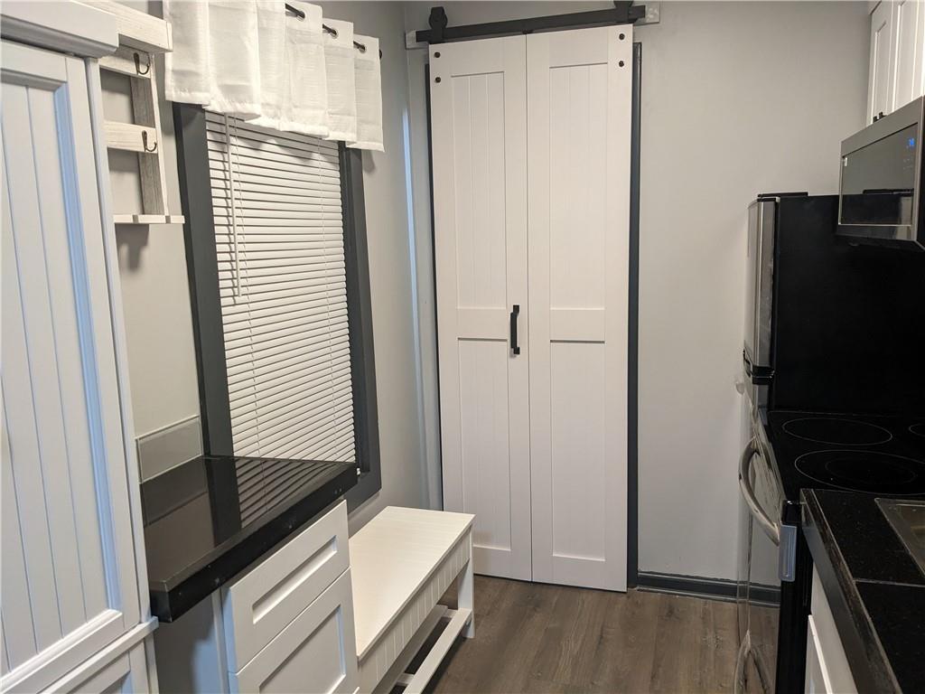 7 7th Street Bessemer, PA 16112 - Photo 6 of 24 a view of a hallway with workspace and a window