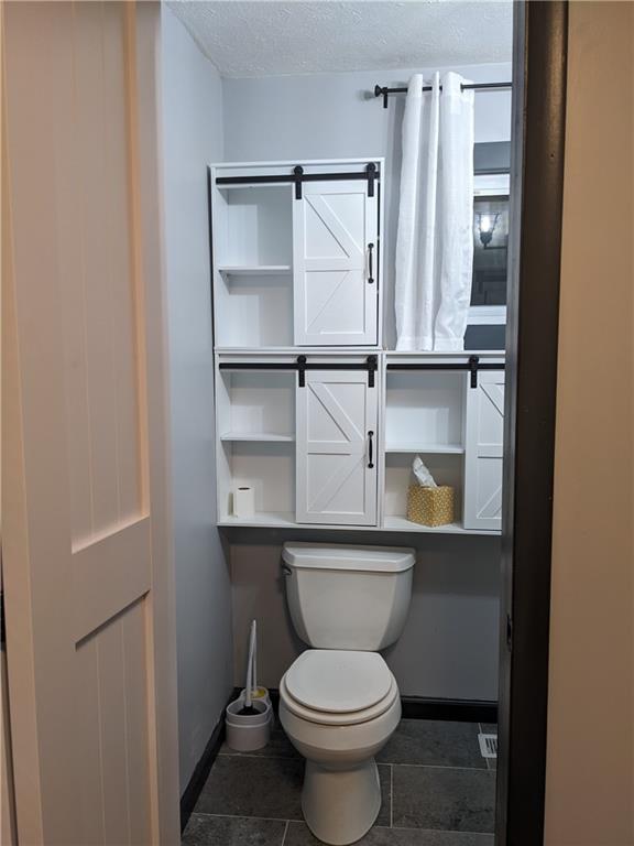 7 7th Street Bessemer, PA 16112 - Photo 10 of 24 a bathroom with a toilet