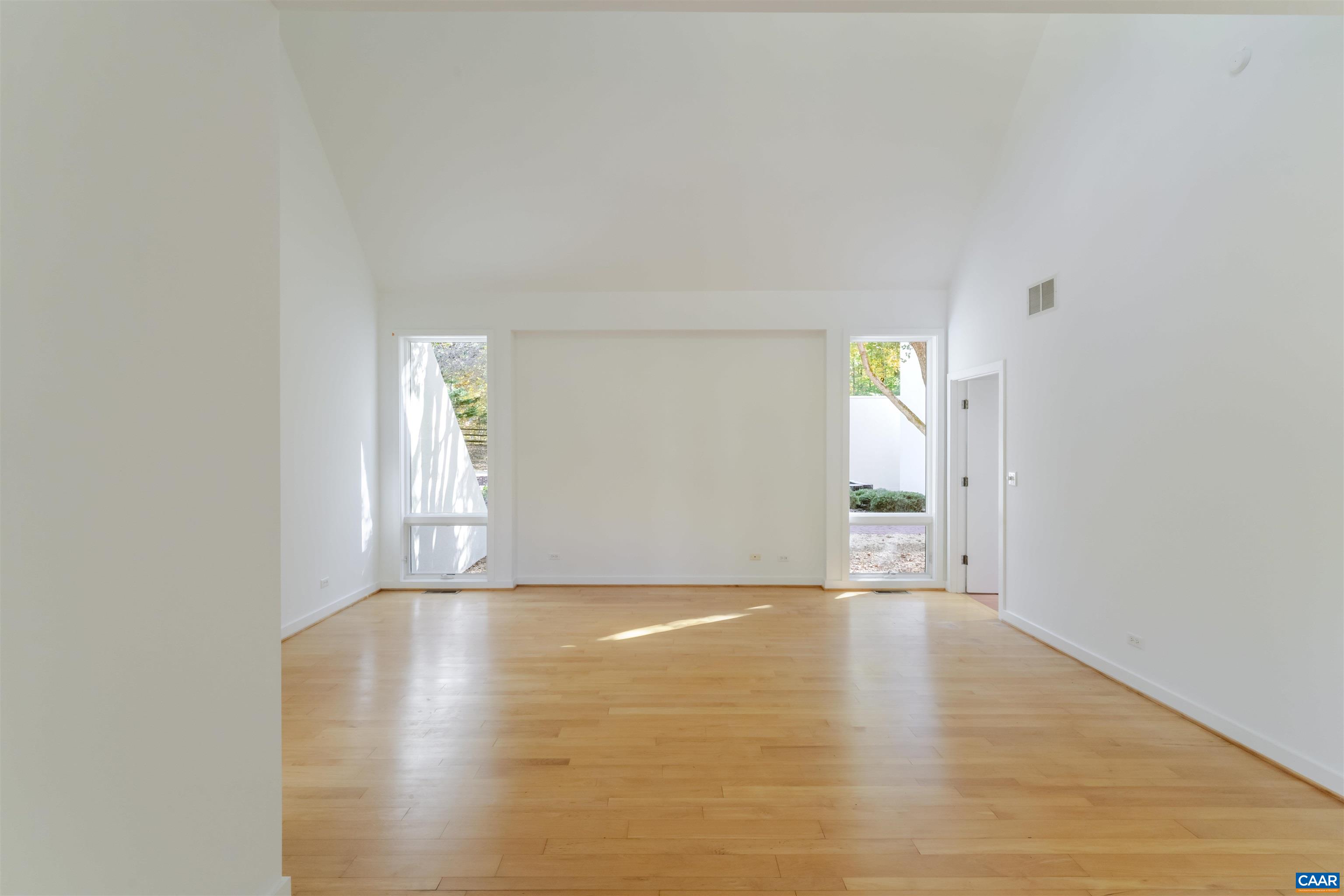 2990 Beau Mont Farm Road Charlottesville, VA 22901 - Photo 16 of 38 a view of an empty room with wooden floor and a window