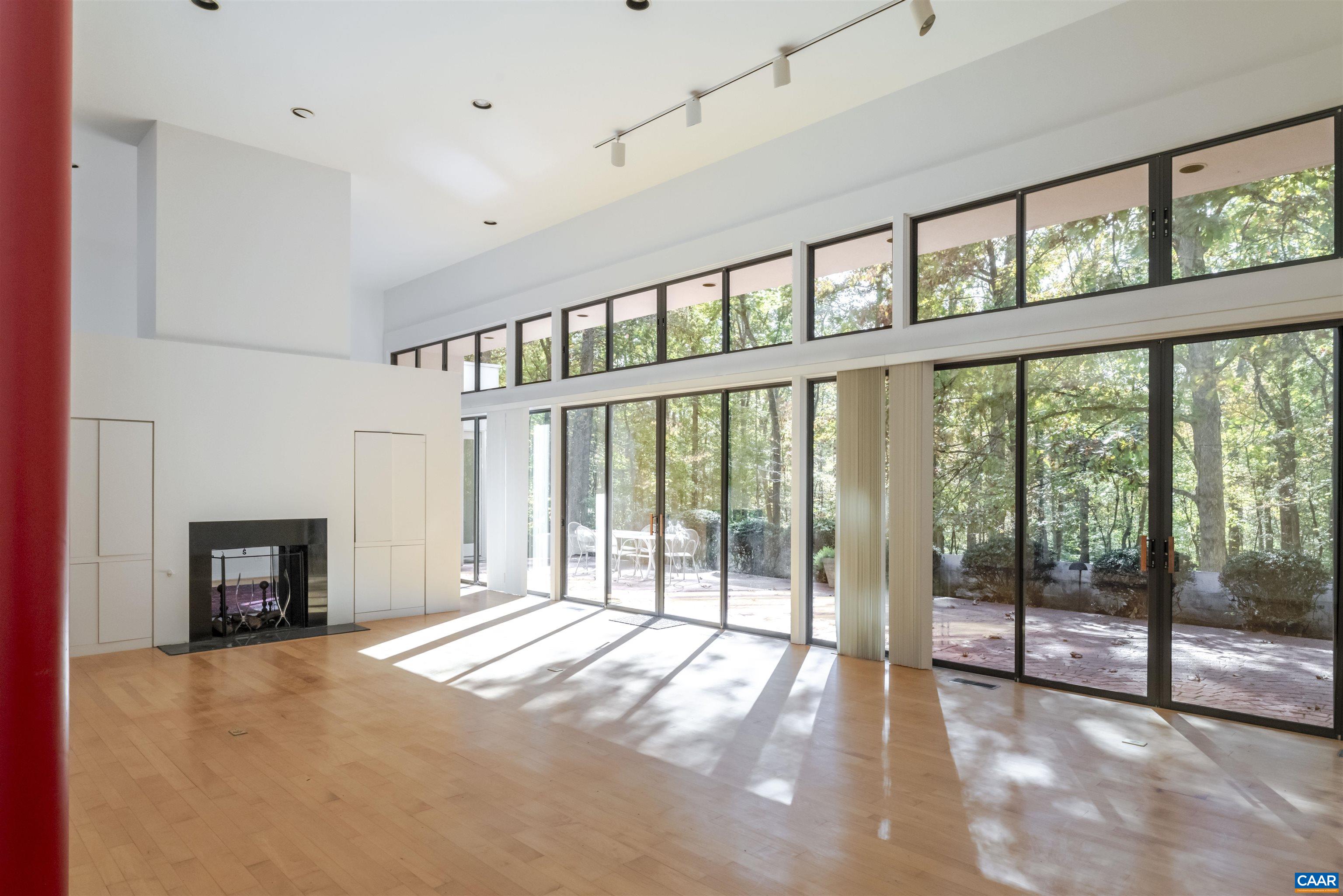 2990 Beau Mont Farm Road Charlottesville, VA 22901 - Photo 4 of 38 a view of an empty room with window and a fireplace