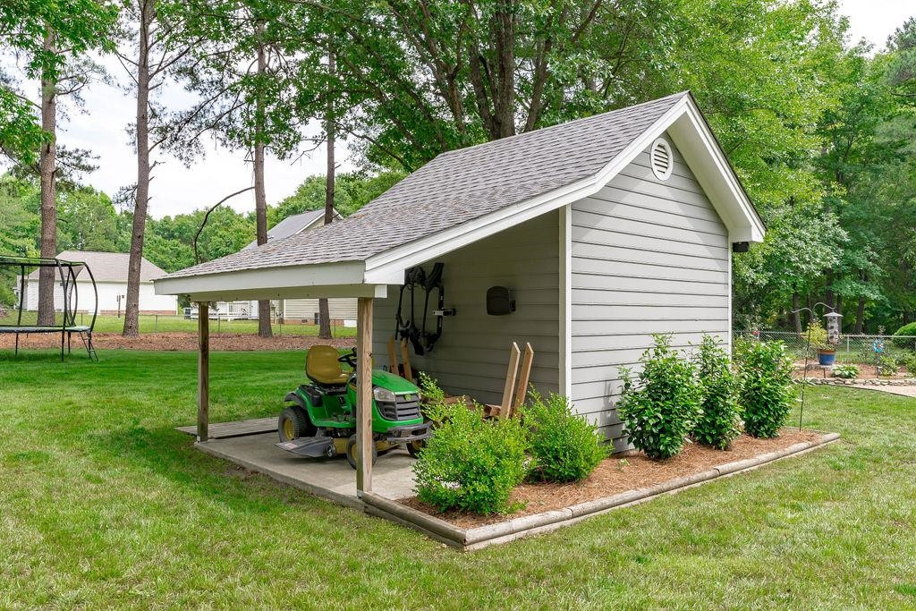 5208 Rivington Road Fuquay-Varina, NC 27526 - Photo 21 of 30 Shed with Covered Awning