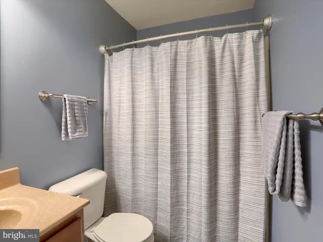 a bathroom with a toilet and a sink