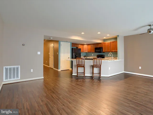 a view of a kitchen with a table and chairs