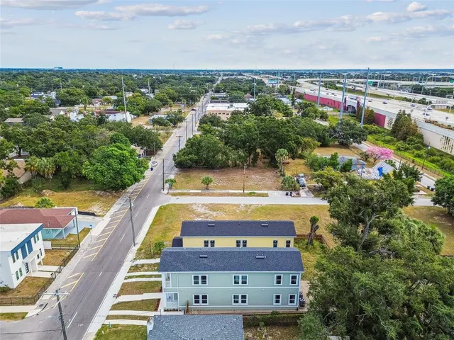 an aerial view of residential houses with outdoor space