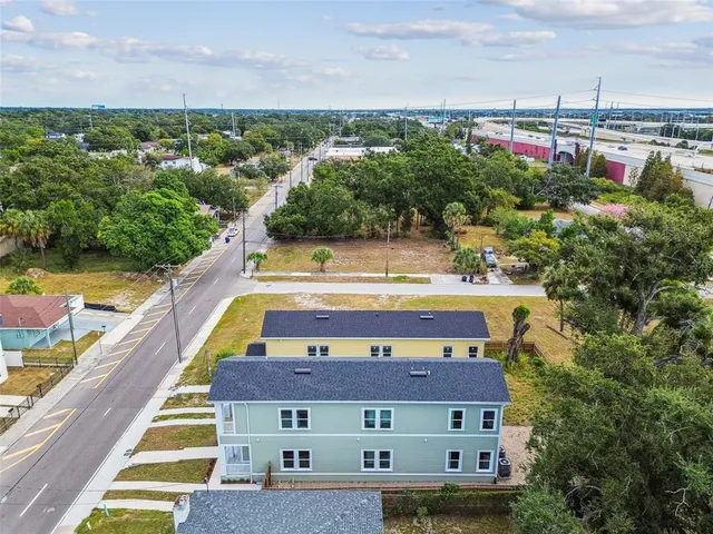 an aerial view of residential houses with outdoor space