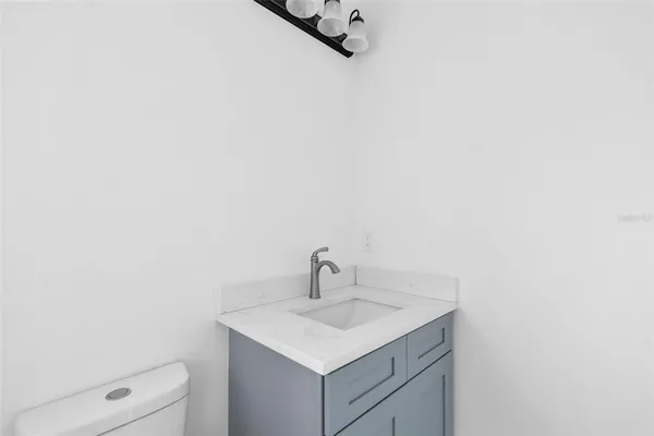 an aerial view of residential house with outdoor space and lake view