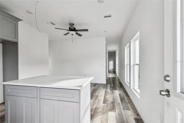 a view of a hallway with a white walls