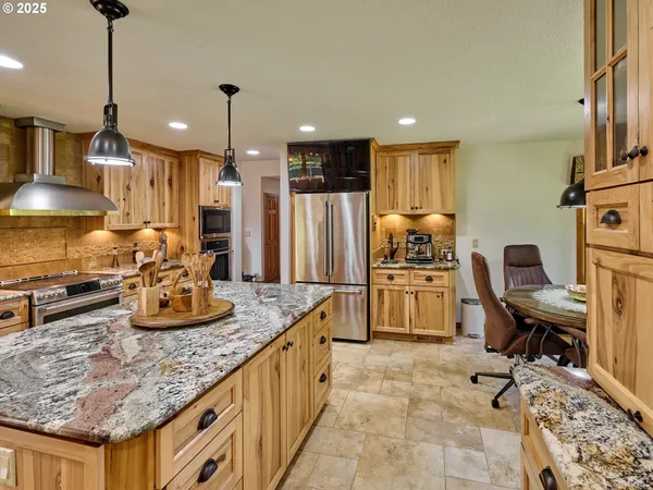 a kitchen with sink stove and refrigerator